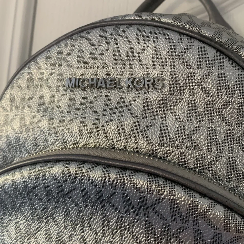 Michael Kors Silver shimmer Monogram Backpack shiny zipper leather compartments‎